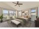 A styled main bedroom featuring a sitting area and lots of natural light at 1960 E 166Th Dr, Thornton, CO 80602