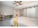 Basement bedroom with a bed, desk, and ceiling fan at 2237 Barela Dr, Berthoud, CO 80513