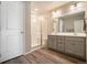 Modern bathroom with double vanity, large mirror, and shower at 2237 Barela Dr, Berthoud, CO 80513