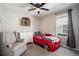 bedroom with a red race car bed and gray armchair at 2237 Barela Dr, Berthoud, CO 80513