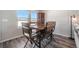 Charming dining area with wooden table and metal chairs, near a window at 2237 Barela Dr, Berthoud, CO 80513