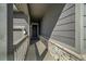 Covered entryway with a stone facade and gray siding at 2237 Barela Dr, Berthoud, CO 80513