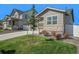 Charming craftsman style home with a manicured lawn at 2237 Barela Dr, Berthoud, CO 80513