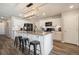 Modern kitchen with white cabinets, a large island, and stainless steel appliances at 2237 Barela Dr, Berthoud, CO 80513