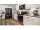 Bright kitchen featuring stainless appliances, light countertops, and ample cabinet space at 2237 Barela Dr, Berthoud, CO 80513