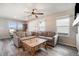 Bright and airy living room with large windows and a comfortable seating area at 2237 Barela Dr, Berthoud, CO 80513