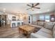 Open living room features a cozy sectional sofa and a rustic coffee table at 2237 Barela Dr, Berthoud, CO 80513