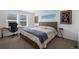 Bright bedroom featuring a modern bed, desk, and contemporary artwork for a comfortable, stylish space at 19197 E 64Th Ave, Denver, CO 80249