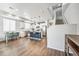 Bright kitchen featuring an island with bar seating, stainless steel appliances, and a dining area at 19197 E 64Th Ave, Denver, CO 80249