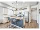 Modern kitchen featuring granite countertops, stainless steel appliances, and a breakfast bar at 19197 E 64Th Ave, Denver, CO 80249