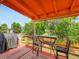Outdoor deck area perfect for relaxation and entertainment with seating and a grill at 15769 E Greenwood Dr, Aurora, CO 80013