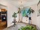 Bright dining room with modern chandelier, large window, and ample natural light at 15769 E Greenwood Dr, Aurora, CO 80013