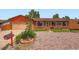 Charming brick and siding single Gathering home with well kept front yard and attached garage at 15769 E Greenwood Dr, Aurora, CO 80013