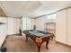 Basement game room featuring a billiard table, carpeted floors, and good lighting at 15769 E Greenwood Dr, Aurora, CO 80013