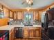 Kitchen featuring custom cabinets, granite countertops, and modern appliances at 15769 E Greenwood Dr, Aurora, CO 80013