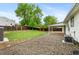 This yard boasts a graveled area and a well-maintained lawn with mature trees at 4672 S Lewiston Way, Aurora, CO 80015