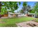 Large, level backyard with a covered patio is perfect for outdoor enjoyment at 4672 S Lewiston Way, Aurora, CO 80015