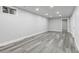 Finished basement offers flexible living space with modern vinyl flooring and recessed lighting at 4672 S Lewiston Way, Aurora, CO 80015