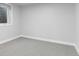 This bedroom offers a cozy retreat with soft carpeting and a bright window at 4672 S Lewiston Way, Aurora, CO 80015