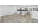 Modern kitchen with sleek stainless steel appliances, black backsplash, and a center island at 4672 S Lewiston Way, Aurora, CO 80015