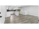 Open kitchen featuring an island, stainless steel appliances, and gray floors for a modern look at 4672 S Lewiston Way, Aurora, CO 80015