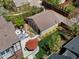 Charming backyard features an outdoor dining set and lounge seating with a decorative umbrella on the patio at 1024 S Columbine St, Denver, CO 80209