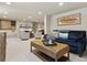 Finished basement living area with comfortable seating arrangements, a fireplace, and decorative accents at 1024 S Columbine St, Denver, CO 80209