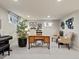 Basement office area with natural light, a charming desk, and tastefully decorated walls at 1024 S Columbine St, Denver, CO 80209