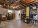 Unfinished basement featuring exposed ceiling, concrete floor, and ample space for storage or customization at 1024 S Columbine St, Denver, CO 80209