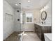 Modern bathroom featuring a glass shower, stylish vanity, and hexagon tile flooring at 1024 S Columbine St, Denver, CO 80209