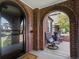 Inviting front porch with comfortable seating, brick arches, and an open view at 1024 S Columbine St, Denver, CO 80209