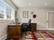 Bright home office with a large wooden desk and rug at 1024 S Columbine St, Denver, CO 80209