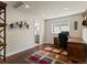 Home office with hardwood floors, decorative art, and a glimpse of a bathroom at 1024 S Columbine St, Denver, CO 80209