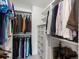 Walk-in closet with shelving, drawers, rods for hanging clothing and accessories at 1024 S Columbine St, Denver, CO 80209