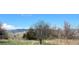 Expansive backyard view with mature trees and stunning mountain views at 4945 Twin Lakes Rd # 44, Boulder, CO 80301