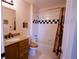 Bathroom featuring a shower-tub combo, a wood vanity with granite countertops, and a toilet at 4945 Twin Lakes Rd # 44, Boulder, CO 80301