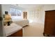 Bright bedroom with a large window, a cozy bed, and decor at 4945 Twin Lakes Rd # 44, Boulder, CO 80301