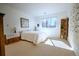 Sunlit bedroom featuring a large window and neutral decor for a calm atmosphere at 4945 Twin Lakes Rd # 44, Boulder, CO 80301
