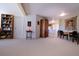 Open dining area connecting to the kitchen with carpeted floors and neutral walls at 4945 Twin Lakes Rd # 44, Boulder, CO 80301
