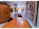 Cozy dining area with wood table, chairs, and hutch, complemented by a view into the kitchen at 4945 Twin Lakes Rd # 44, Boulder, CO 80301