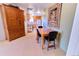 Cozy dining area with wood table, chairs, and hutch, complemented by a view into the kitchen at 4945 Twin Lakes Rd # 44, Boulder, CO 80301