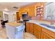 Updated kitchen with an island, modern appliances, wood cabinets, and an open layout at 4945 Twin Lakes Rd # 44, Boulder, CO 80301
