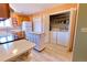 Functional kitchen with modern appliances, an island, wood cabinetry, and convenient laundry access at 4945 Twin Lakes Rd # 44, Boulder, CO 80301