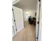 Bright office space with a wooden desk, comfortable chair, and open doorway at 4945 Twin Lakes Rd # 44, Boulder, CO 80301