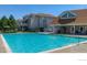 Enjoy the community pool with lounge chairs and well-maintained landscaping on a beautiful sunny day at 4945 Twin Lakes Rd # 44, Boulder, CO 80301
