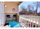 Outdoor porch featuring a railing, a blue mat, chairs, and views of the surrounding landscape at 4945 Twin Lakes Rd # 44, Boulder, CO 80301