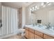 Bright bathroom featuring a double sink vanity and a shower over tub at 3546 Broadlands Ln # 102, Broomfield, CO 80023