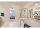 This bathroom includes a soaking tub, stand-up shower and access to the Primary bedroom at 3546 Broadlands Ln # 102, Broomfield, CO 80023