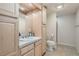 Cozy bathroom with a stylish vanity, mirror, and ample storage space, plus toilet and stand-up shower at 3546 Broadlands Ln # 102, Broomfield, CO 80023