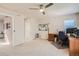 Bedroom featuring neutral paint, and a ceiling fan plus a desk area at 3546 Broadlands Ln # 102, Broomfield, CO 80023